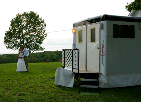 A white trailer with two doors and stairs.